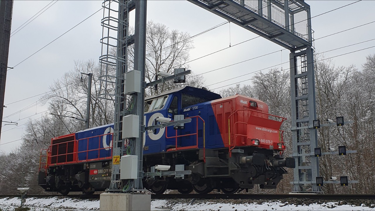 A shunting locomotive passing by the visual inspection system.